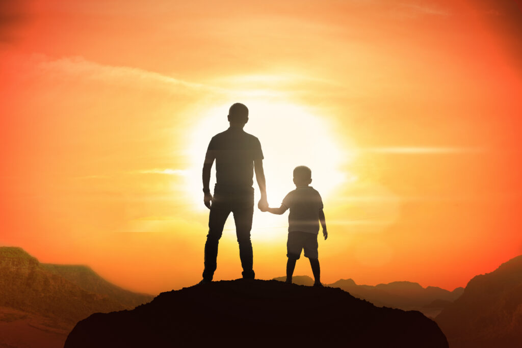 Father and Son Appreciating the Beautiful Sunset